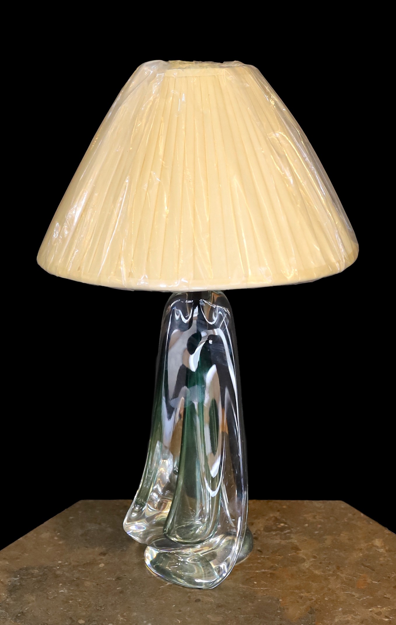 A 1960s Murano glass lamp base, of twisted form, with replacement pleated silk shade, height 38 cm